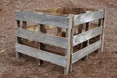 Stand the pallets up to configure the raised bed.