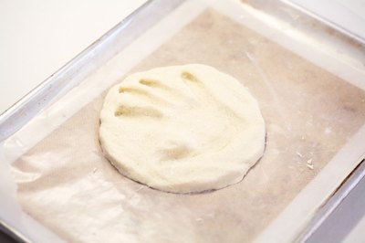 Press your child's hand into the dough.