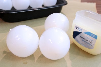 Cover the balloons with petroleum jelly