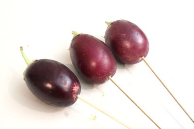 Insert skewers in eggplant