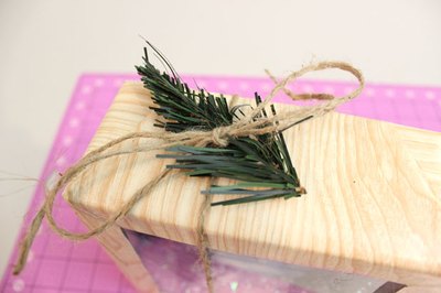 Finish the box with twine and an artificial tree.