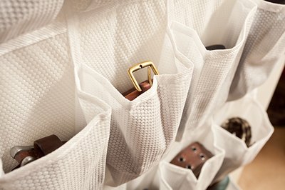 Don't limit your shoe rack to shoes only -- use the pockets to store small items like belts and jewelry.