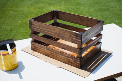 Applying wood stain to the basket.
