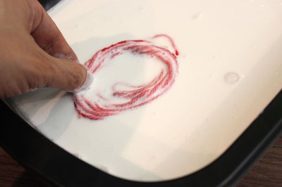 Soak the yarn in the glue mixture