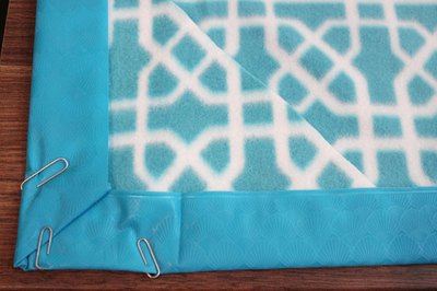 Fold the vinyl over the fleece