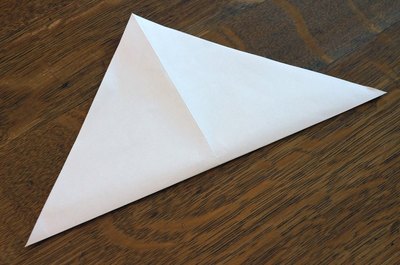 Locate the center with diagonal folds.
