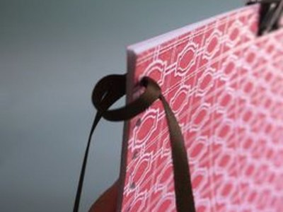 Loop ribbon through first hole.