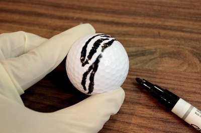 Paint zebra stripes on the golf ball