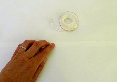 Attach two sheets of freezer paper.