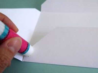 Use a glue stick to secure the bottom of the envelope.