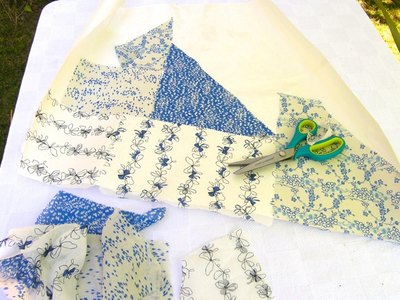 Iron fabric pieces onto freezer paper.
