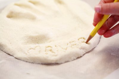 Etch your child's name into the dough.