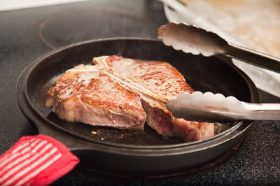 T-bone steak in pan.