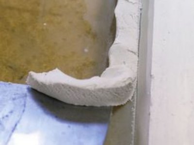 Clean the excess compound from the glass.