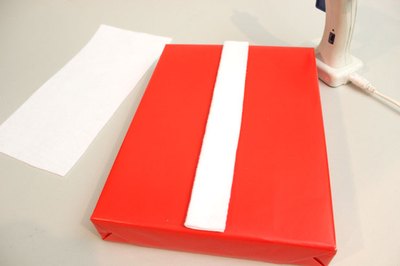 Glue white felt to the box to make a placket.