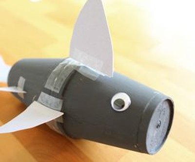 Use tape to attach the fins and tail.