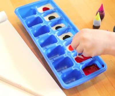 Mix food coloring with condensed milk to create the edible paint colors.