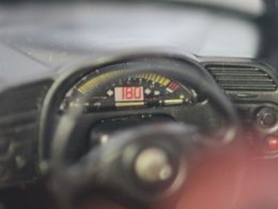 The dashboard decal on this model car had to be applied before all the parts were painted or assembled.
