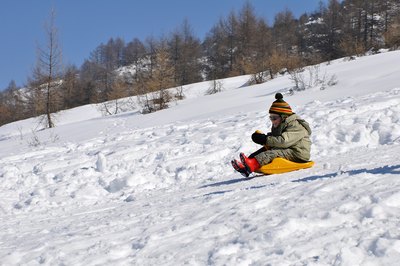 Sit feet-first when sledding.