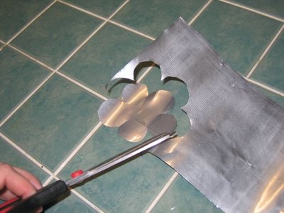 Cut flower shapes from the aluminum sheet