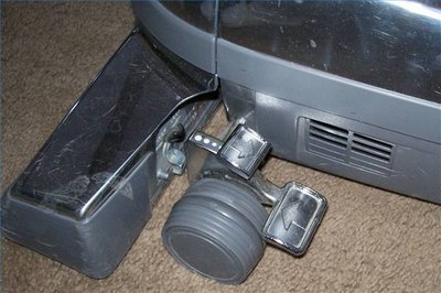 Tap to raise or lower the "business end" of the vacuum.
