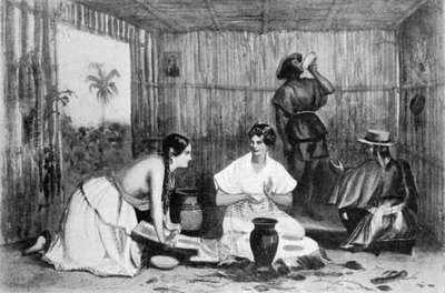 Women grinding chocolate