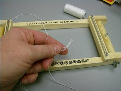 Knot the ends of the thread