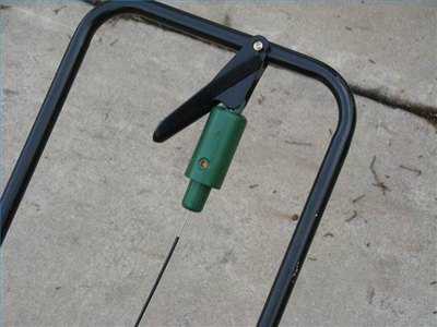 Application rates are programed on this spreader by turning the green cylinder until the correct number appears.