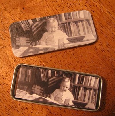 photo being inserted into tin lid