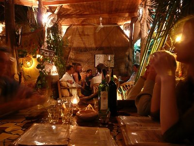 Patrons dine in an elegant restaurant, complete with a classy ambiance.