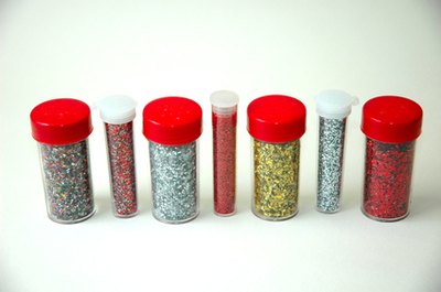 The appearance of braces or cavities can be added using white glue and glitter.