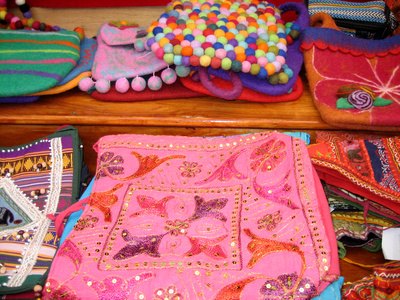 Handmade purses are an option of what to sell at a flea market.