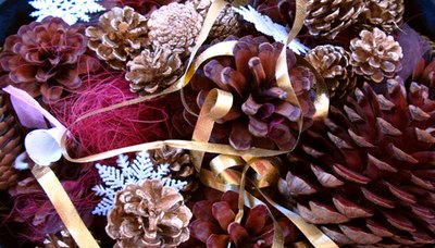Pine cones with ribbon and glitter make glamorous winter table decorations.