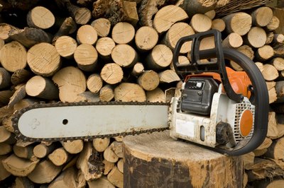 Use a chain saw to save time when you cut trees.