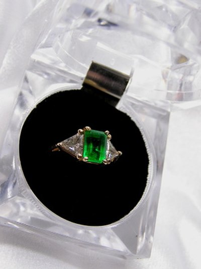 Emerald stones contain inclusions, or tiny fractures and mineral defects.