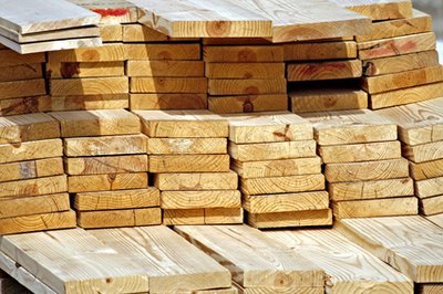 Determine lumber needs for the walls, including whether to use planks, sheets of plywood or tin.