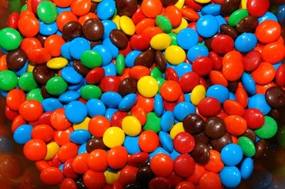 You can purchase candy with custom sayings and photos. How about "80s baby"?
