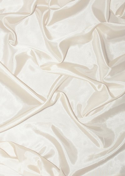 Drape the white material like snow.