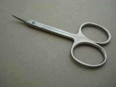 Cosmetic scissors with blades under four inches are allowed.
