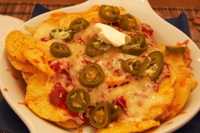Nacho cheese dip tops it all