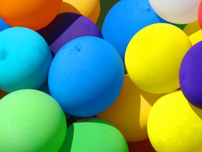 A mountain of balloons makes getting into the office tough work.