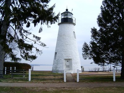 The wood donuts help keep a cone-shaped lighthouse sturdy.