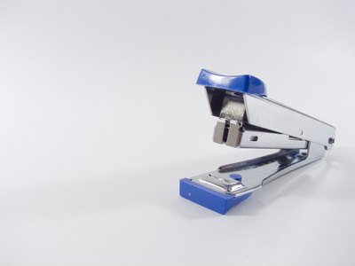 Use a stapler to join the poster board tooth pieces together.