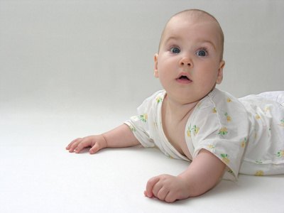 She holds her head up during tummy time.