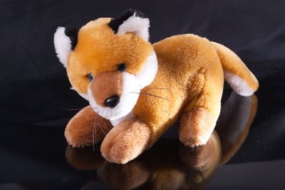 Using stuffed animals in the shapes of a fox and a hen makes the game more concrete to three-year-olds.