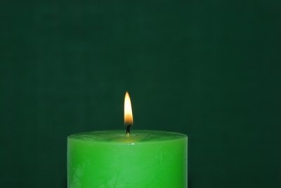 Instead of a plain candle, create one covered in shells.