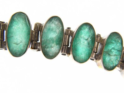 The beauty of emeralds is defined through the defects that add depth to their color.