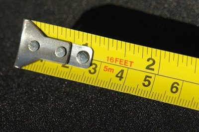 Measuring tape is used to obtain correct dimensions for the tooth costume.