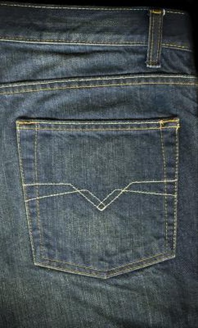 The back pack on a pair of jeans