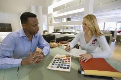 man looking at paint samples
